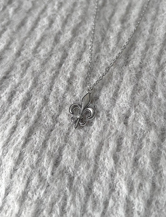 Silver Fleur Icon pendant by Caelis Cole featuring intricate floral design and polished finish.