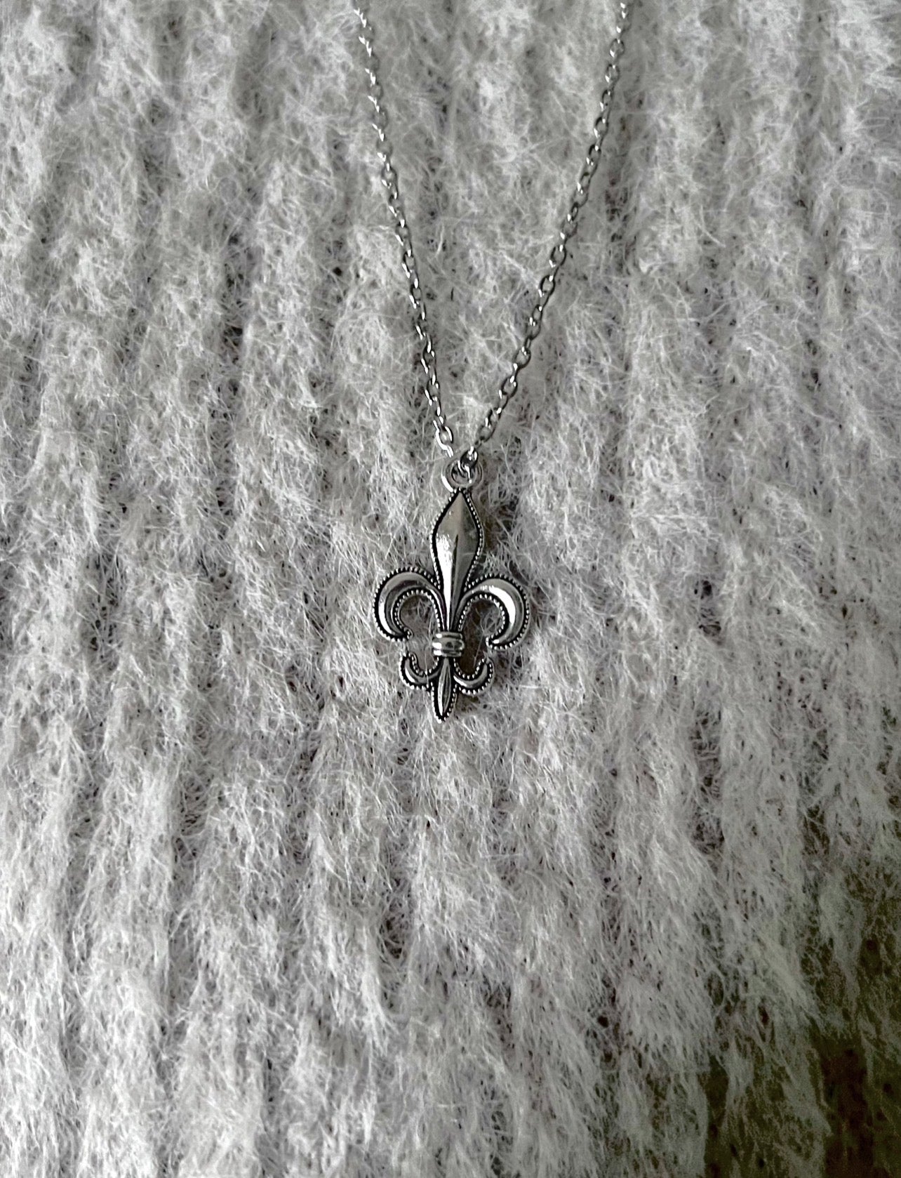 Silver Fleur Icon pendant by Caelis Cole featuring intricate floral design and polished finish.